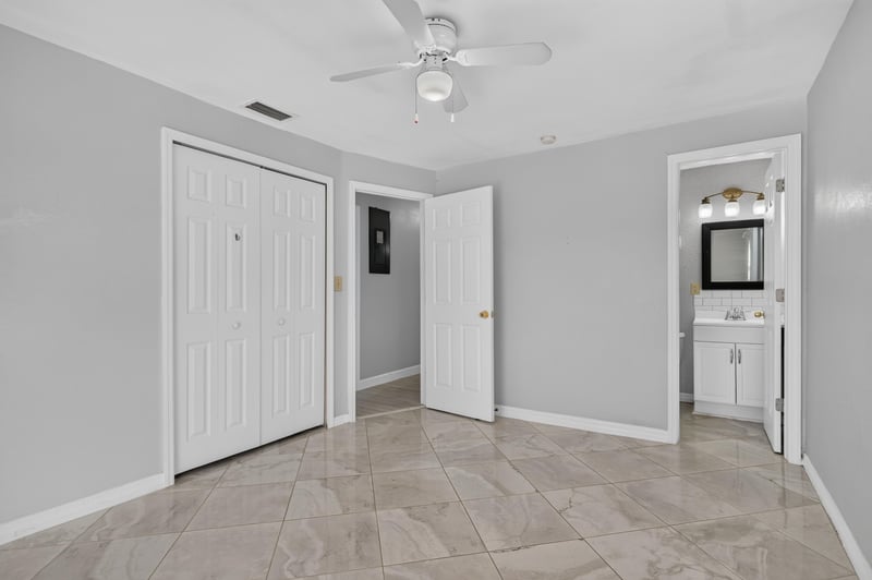 Hallway with closet doors and tile flooring at 442 Ameca Ave, Orange Park, FL 32073