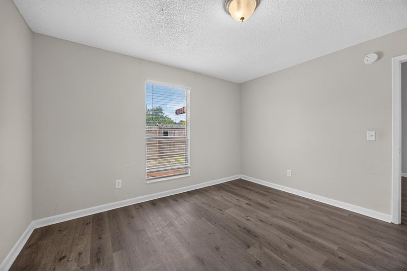 Room with window and wood-look flooring at 2719 Trollie Ln