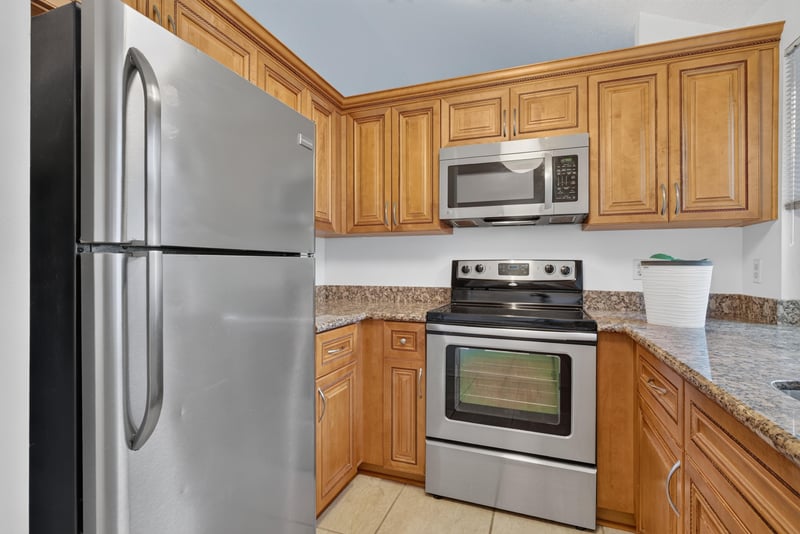 Kitchen with refrigerator and range at 3515 Cormorant Branch Ct, Jacksonville, FL