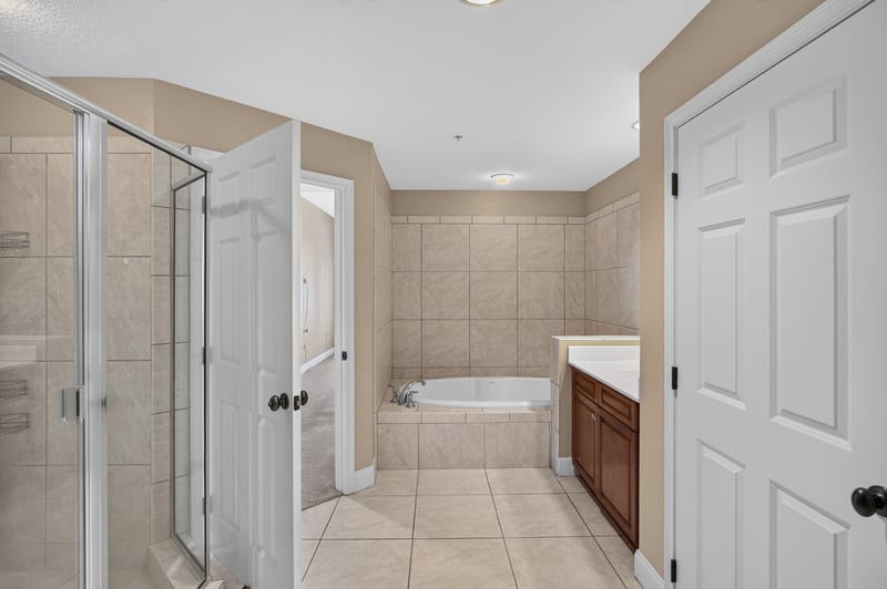 Bathroom with shower, tub and double doors at 1478 Riverplace Blvd 1904, Jacksonville, FL 32207