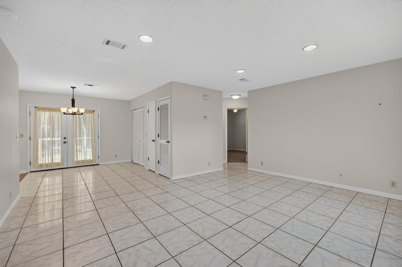 Open living area with tile floors and recessed lighting at 2829 Blackberry Ave