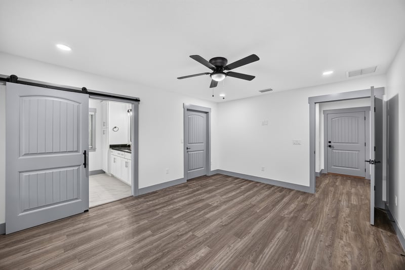 Hallway with sliding barn door at 4800 Acacia St, Middleburg, FL 32068