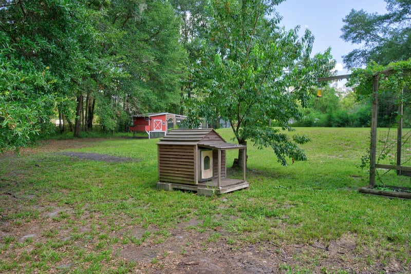 Wooden outdoor structure in the side yard at 2549 Snapdragon Ave, Middleburg, FL 32068