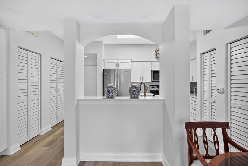 Kitchen pass-through with white countertops at 10435 Mid Town Pkwy unit 135, Jacksonville, FL 32246