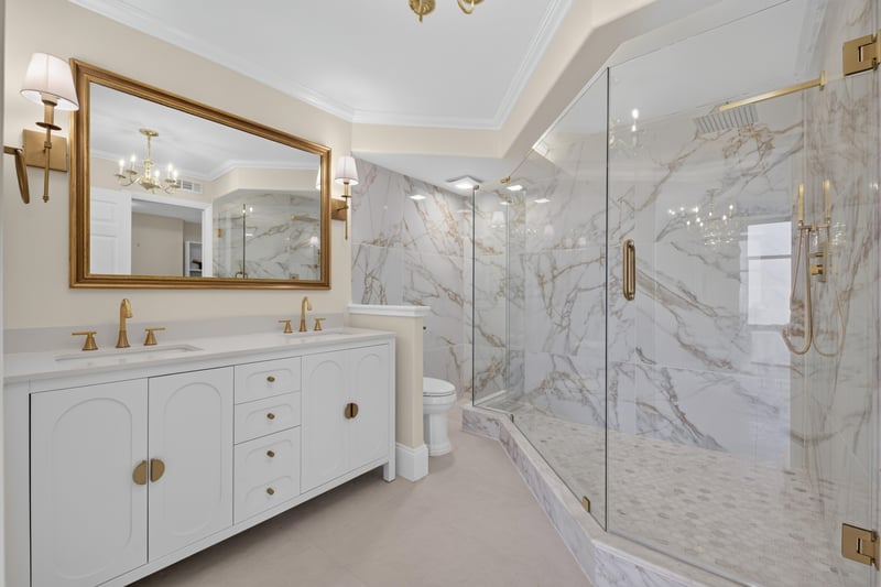 Primary bathroom with marble double vanity and glass shower at 1301 1st St S