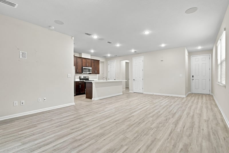 Kitchen view from the open living space at 7088 Mahogany Run Dr, Jacksonville, FL 32244