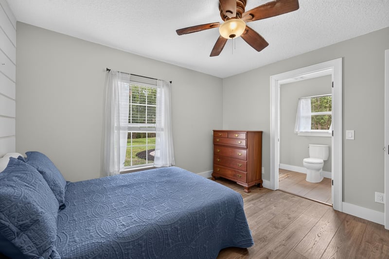 Bedroom with two beds and blue bedding at 1161 Whispering Pines Rd, Jacksonville, FL 32259