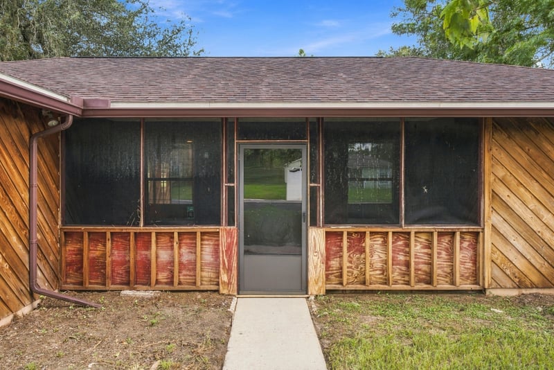 Screened front porch entry with door at 2915 Trenton Ct, Orange Park, FL