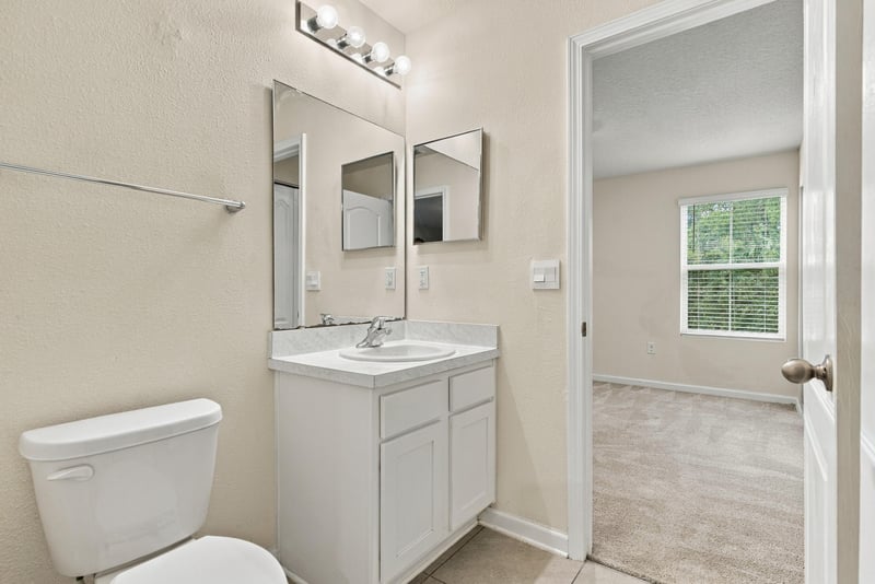 Bathroom vanity with mirror at 9555 Star Dr, Jacksonville, FL 32256