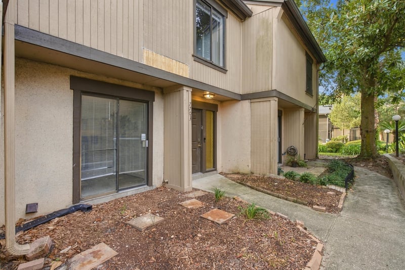 Front entry walkway and glass door at 7703 Las Palmas Way