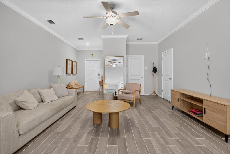 Wide living room with ceiling fan at 1186 Beach Dune Dr, Jacksonville, FL 32233