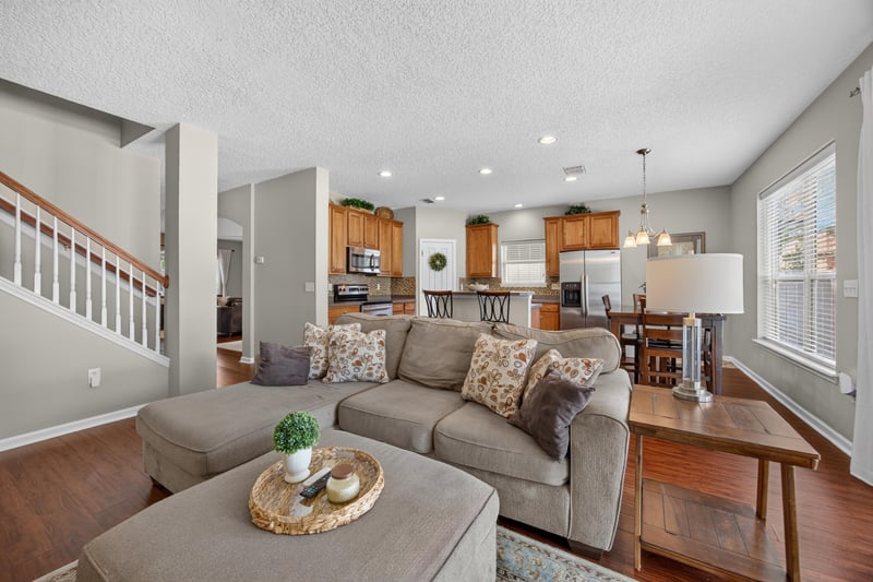 Living room with sectional sofa near the stairs at 3660 Middlebrook Dr, Orange Park, FL 32065