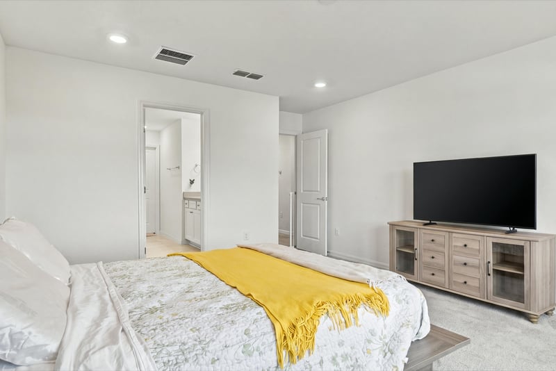 Bedroom with wall-mounted television, photographed by Megapixeler on Torres Trace, St. Augustine