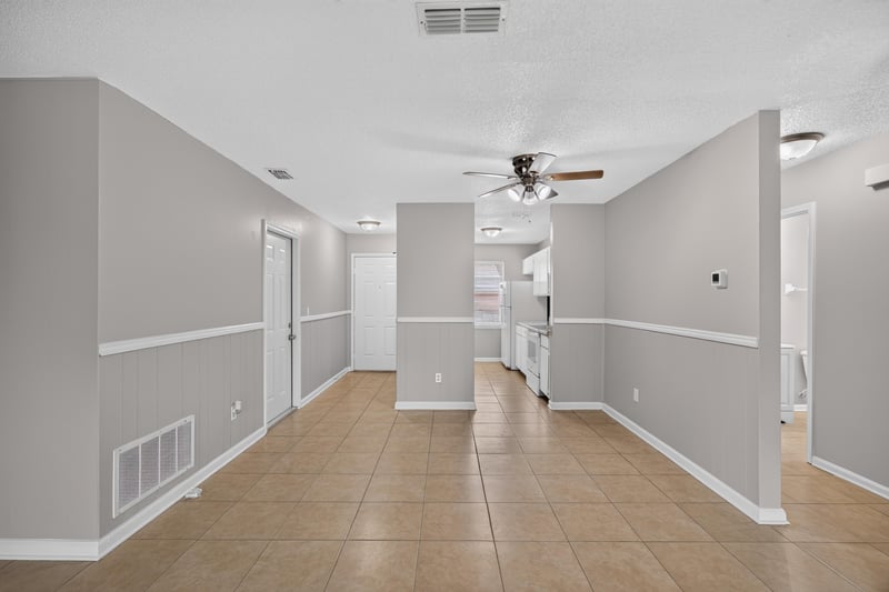 Open living and dining area with tile floor at 1040 Willow Cove Ct E, Jacksonville, FL 32233