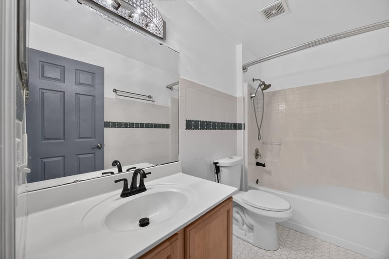 Bathroom with white vanity and tub at 3428 Glenn Hollow Ct, Jacksonville, FL 32226