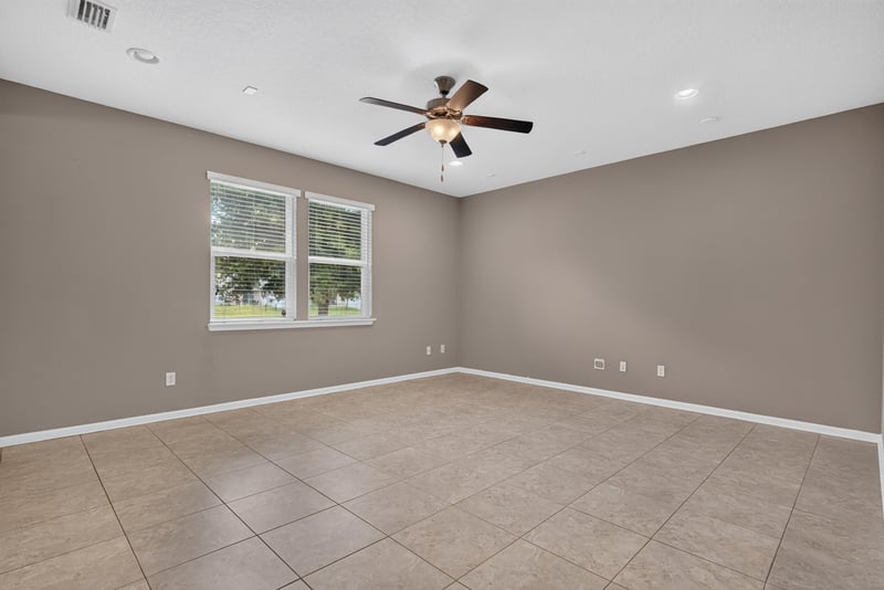Open room with tile floor and ceiling fan at 263 Gilmore Ln, Orange Park, FL 32065