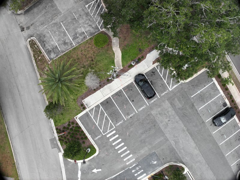 Aerial view of parking lot and landscaped strip at 9406 Atlantic Blvd, Jacksonville, FL 32225
