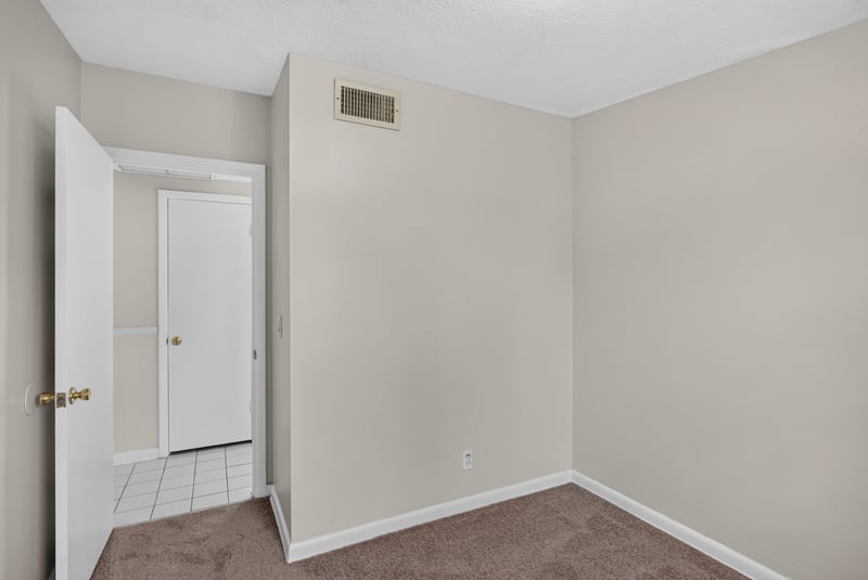 Hallway with open door and tile floor at 87 Saratoga Cir S, Atlantic Beach, FL