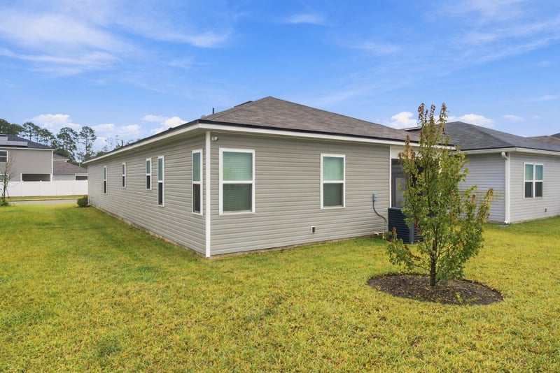 Rear exterior view of the back of the home at 7088 Mahogany Run Dr, Jacksonville, FL 32244