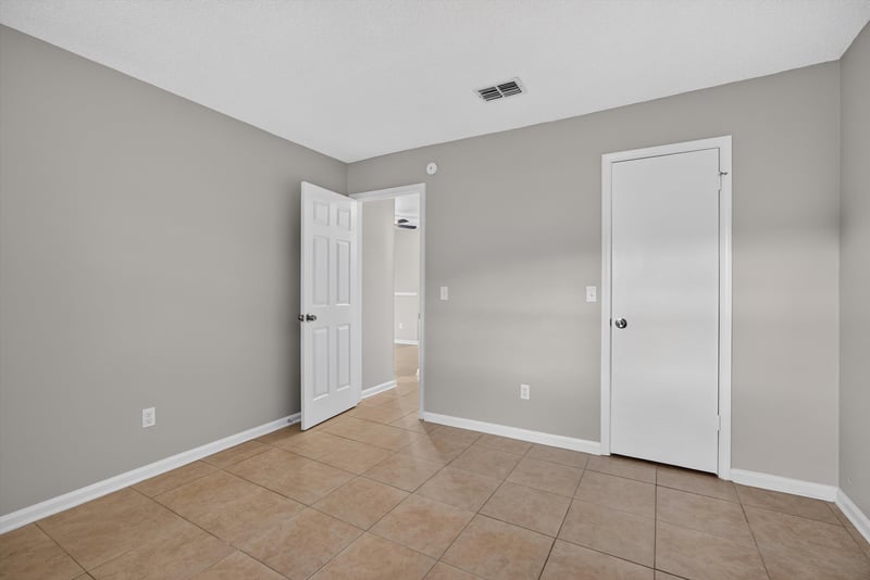 Bedroom with closet doors at 1040 Willow Cove Ct E, Jacksonville, FL 32233