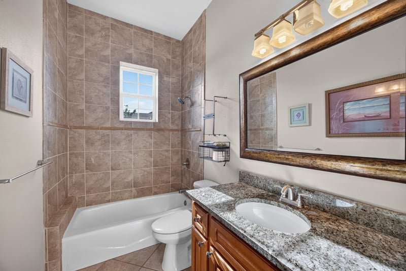 Bathroom vanity with tiled shower at 1735 Hagans Ridge Ct