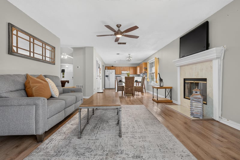 Living room open to kitchen and dining at 8680 Bandera Cir S, Jacksonville, FL 32244