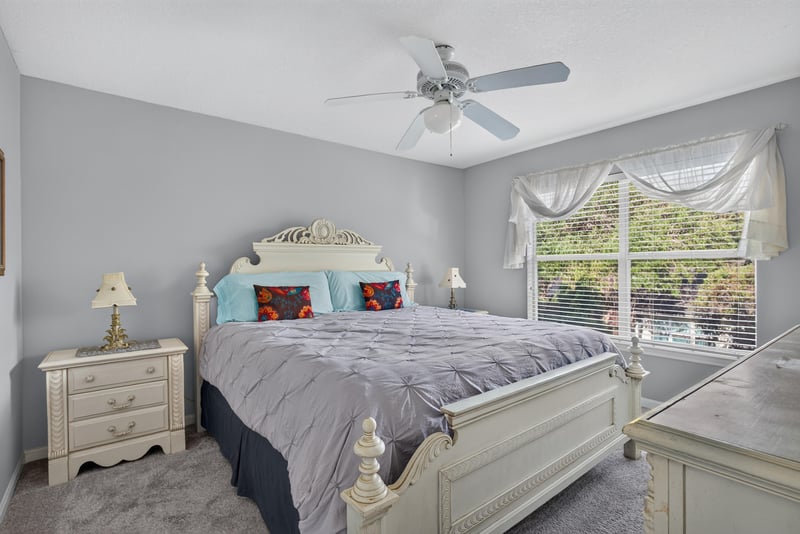 Primary bedroom with bed, nightstands and window at 206 16th St, St. Augustine, FL 32080