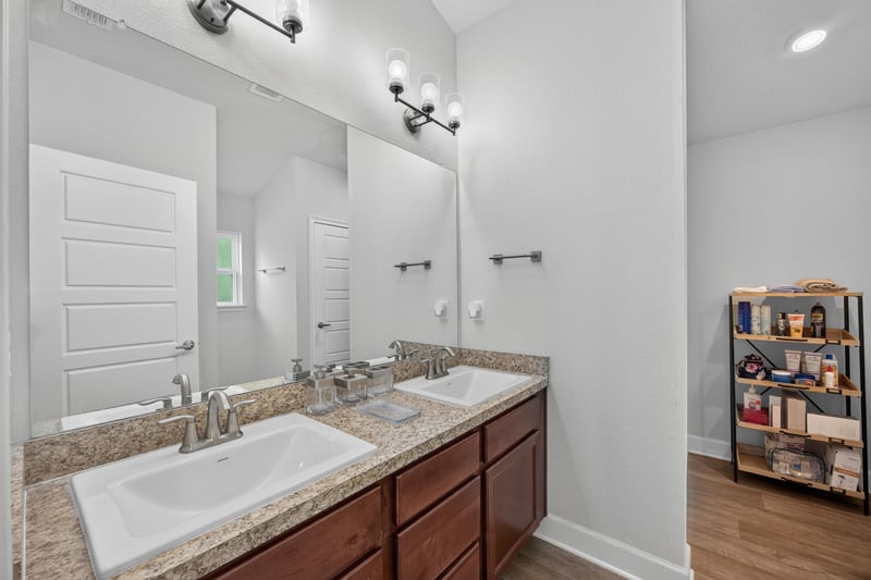 Primary bathroom with double sink vanity at 9846 Olivia St, Jacksonville, FL