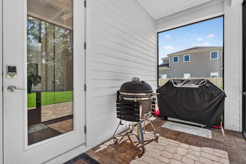 Screened porch with grill at 22 Azura Point
