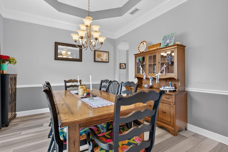 Dining room with wood table and chandelier at 2304 Spring Hill Ct, Orange Park, FL