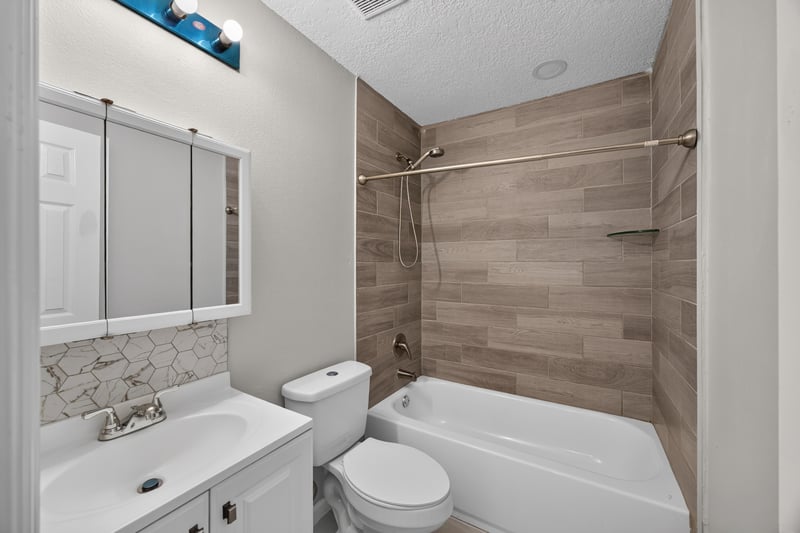 Bathroom with tub-shower combo at 7015 Miss Muffet Ln N, Jacksonville, FL 32210