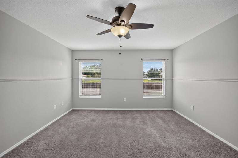 Empty bedroom with carpet and windows at 7545 Lirope St, Jacksonville, FL 32244