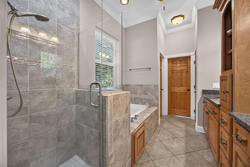 Primary bath walk-in shower with tile surround at 1735 Hagans Ridge Ct