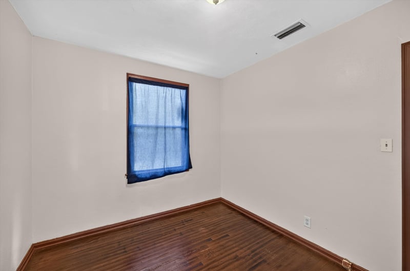 Empty bedroom with blue curtain window at 2132 Allandale Cir W, Jacksonville, FL