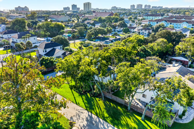 Aerial view of the neighborhood with city skyline in the distance in Jacksonville Beach, FL