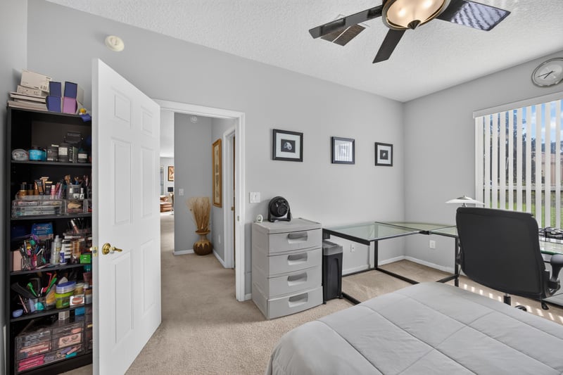 Sitting room with ceiling fan and window at 2875 Pebblewood Ln, Orange Park, FL 32065