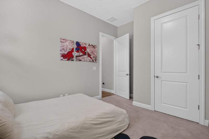 Bedroom with closet doors and wall art at 3328 Southern Oaks Dr, Green Cove Springs, FL 32043