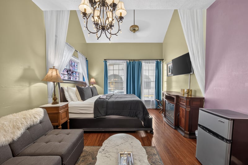 Living room with sofas and a chandelier at 115 Cordova St, St. Augustine, FL