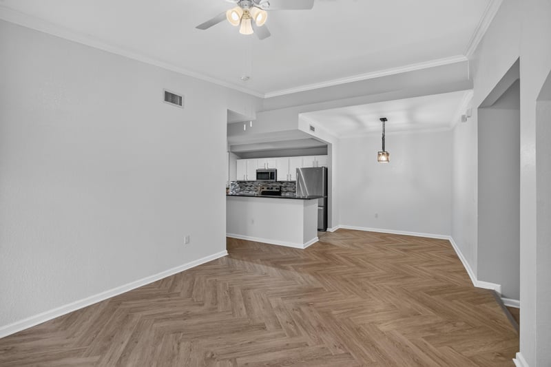 Kitchen with white cabinets and tile backsplash at 10075 Gate Pkwy unit 1905, Jacksonville, FL 32246