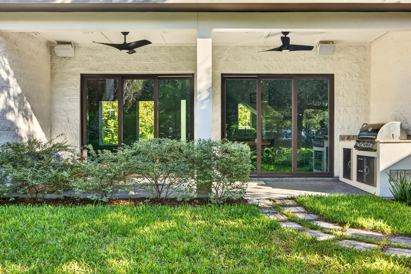 Covered patio with ceiling fans and outdoor kitchen at 722 3rd Ave N, Jacksonville Beach, FL