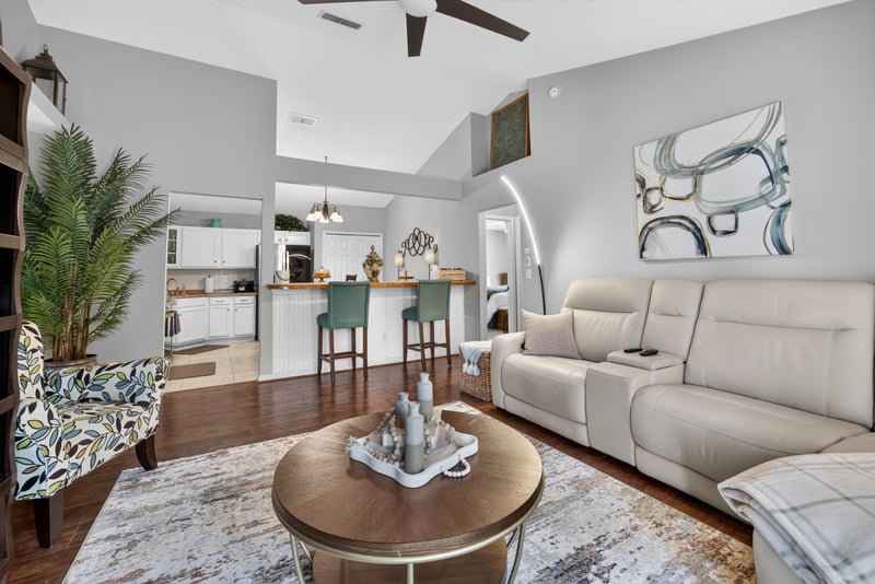Living room and kitchen bar seating area at 3067 Wavering Ln, Middleburg, FL 32068