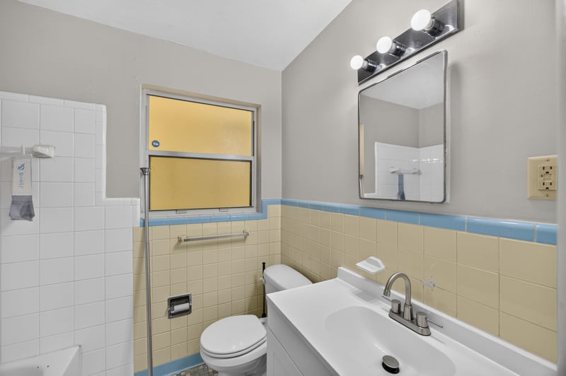 Bathroom with blue tile and vanity at 5527 Beney Rd, Jacksonville, FL 32207
