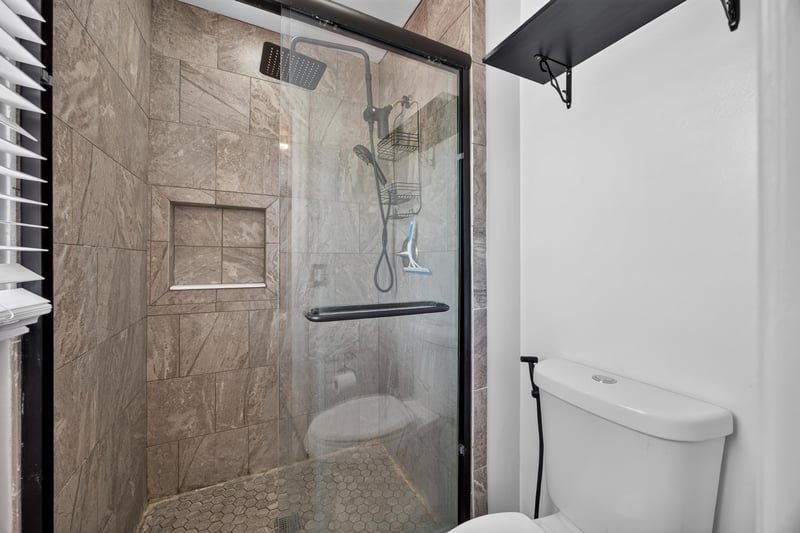 Bathroom with marble-look shower tile at 3428 Glenn Hollow Ct, Jacksonville, FL 32226