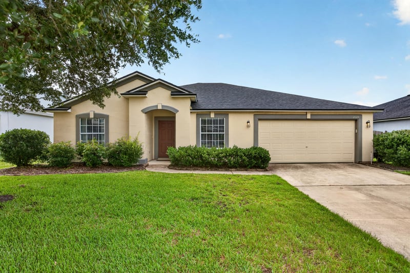 Front exterior with two-car garage and driveway at 2065 Creekmont Dr