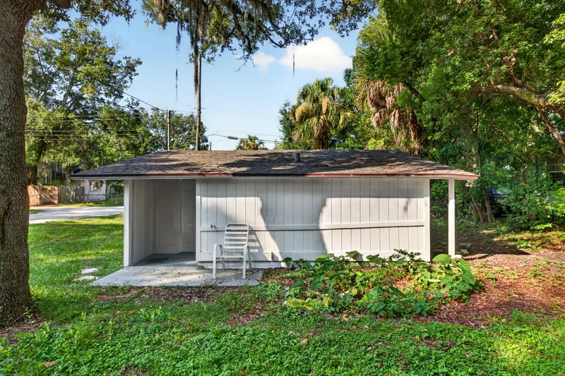 Backyard with grass and side shed at 4951 Halls Dr