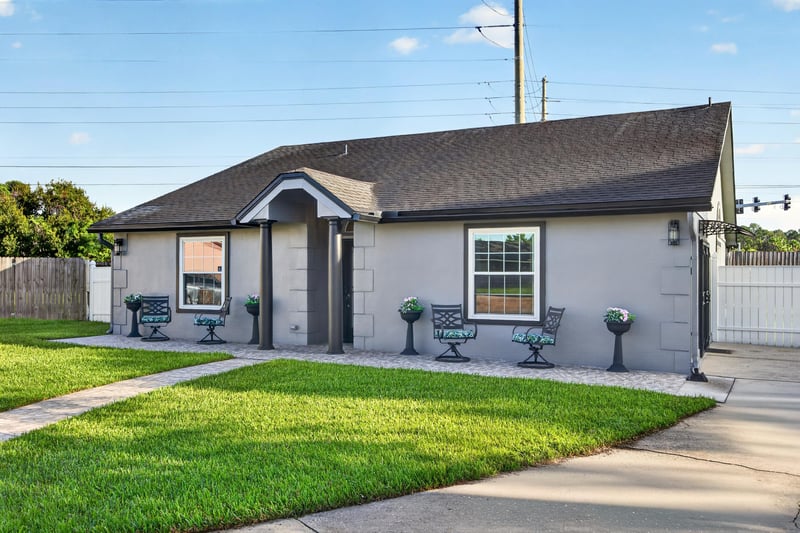 Front exterior side angle with lawn at 6931 Cane Grass Ln E, Jacksonville, FL 32244