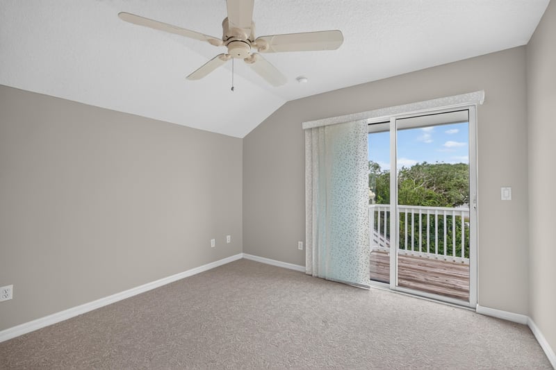 Empty room with sliding door to balcony at 117 Island Cottage Way, St. Augustine, FL 32080