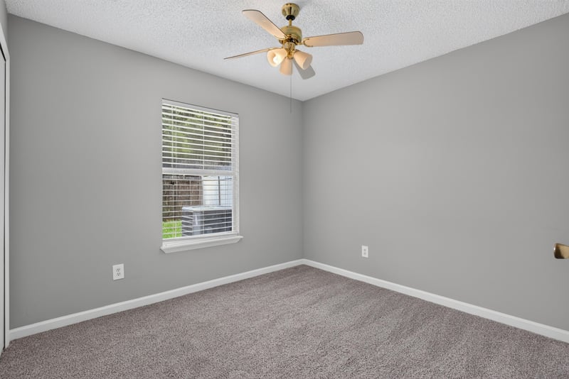 Bedroom with carpet and ceiling fan at 1108 Hidden Cove Cir S, Atlantic Beach, FL 32233