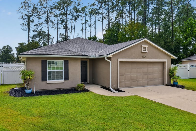 Front exterior and driveway at 706 Grampian Highlands Dr, St. Johns, FL 32259