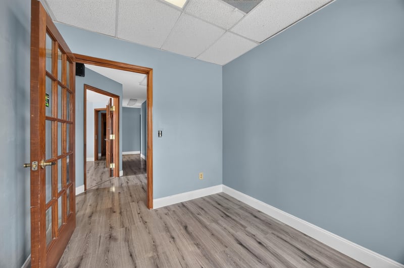 Hallway view with open French doors to adjoining room at 1543 Kingsley Ave #19, Orange Park, FL 32073